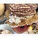 This is a close-up of Mac's custom hat. It is made with fall calico fabric and is decorated with a handmade lace rosette and dried berries.